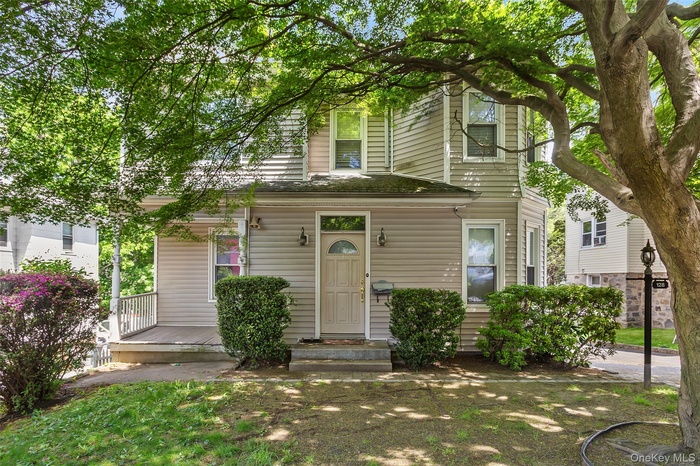 View of front of home featuring covered porch