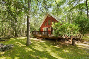 Tucked within the forever wild private community of Wolf Lake, 16 Canal Road offers the rare combination of convenience and tranquility.