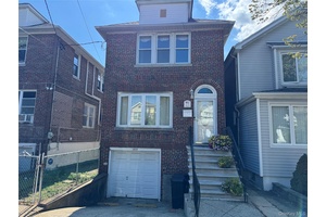 CHARMING TWO STORY HOME IN A PRIME LOCATION Welcome to this well maintained, bright and sunny, character filled two story detached brick home with driveway and a garage.