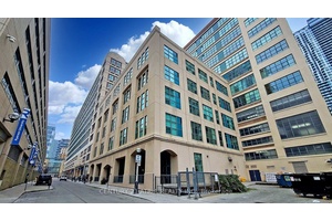 Experience exceptional loft living in this spacious 2 bedroom plus den suite located in the iconic Merchandise Building one of the citys most celebrated hard loft conversions.