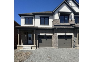 This beautifully crafted end unit townhouse is less than 5 years old and ready to impress.
