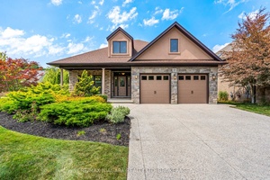 Welcome to this stunning custom built bungalow by Kenneth Homes, perfectly positioned in the upscale St.