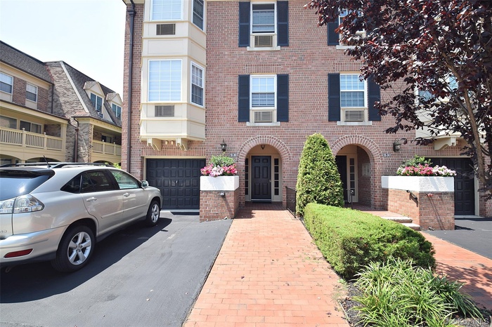 View of front of property featuring brick siding
