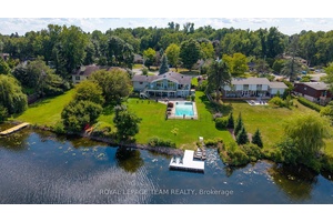 Incredible waterfront bungalow with walk out lower level on Manotick's popular North Island.