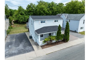 Affordable downtown property on a large city lot with 2 driveways amp ; a large detached garage workshop.