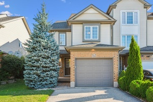 Welcome to 106 Max Becker Drive, a meticulously maintained, move in ready freehold townhome in Kitcheners desirable Williamsburg neighbourhood.