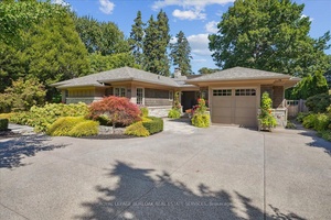 Located in the prestigious and highly sought after neighborhood of Roseland, this elegant bungalow showcases quality finishes throughout.