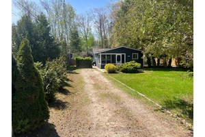 Escape to the ultimate year round Beach Lifestyle at 48 57th Street North in Wasaga Beach, where this charming 875 sq.