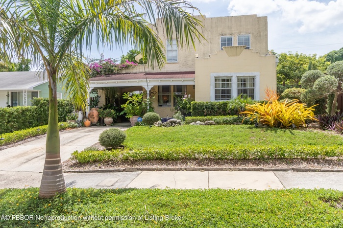 Two-Story Spanish Style House on a pristine street