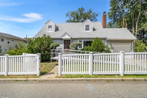 Two family home in the heart of Elmont on an oversized park like property.