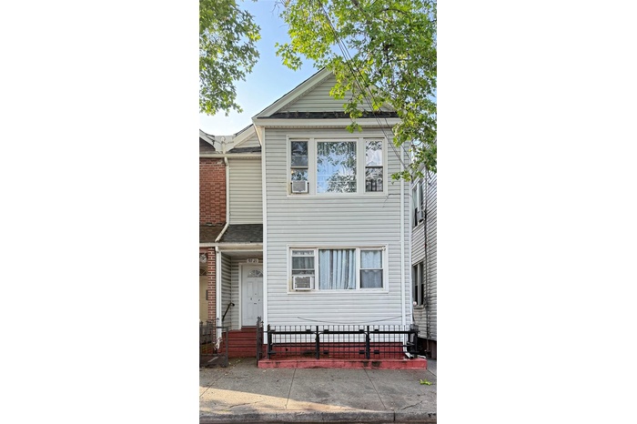 View of front of property with a fenced front yard