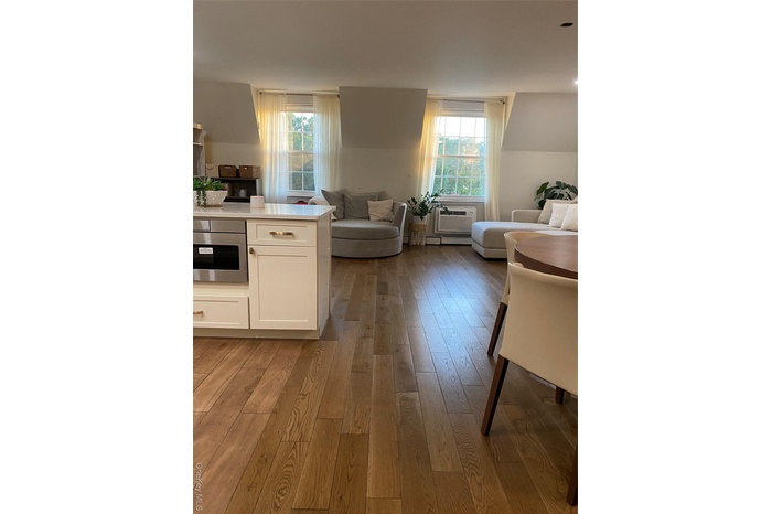 Living area with dark wood-type flooring