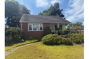 Great Starter home with 3 Bedrooms with hardwood floors, oil heat and gas stove spacious yard for entertaining Don't miss out on this opportunity a real must see !