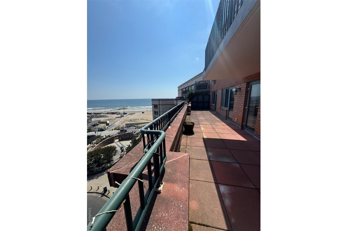 Patio / terrace featuring view of water and beach and a patio area