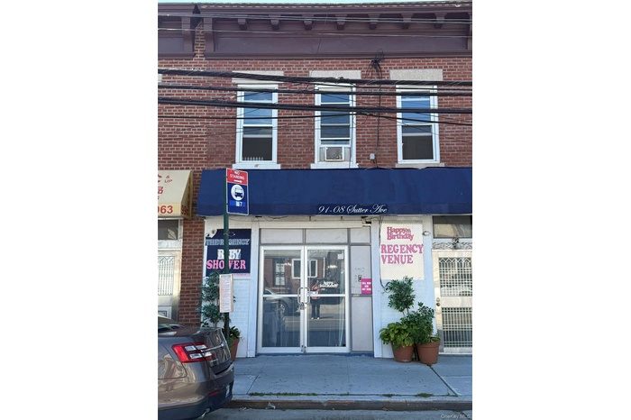 Doorway to property with brick siding