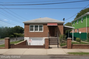 Welcome to this charming brick single family home on a desirable corner lot in East Elmhurst.
