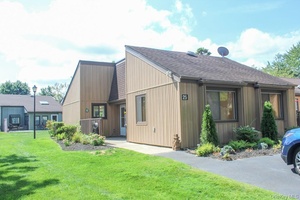 Welcome to 25 Strathmore Gate Dr, a desirable Coventry end unit located in the sought after 55 community of Strathmore Gate in Stony Brook.