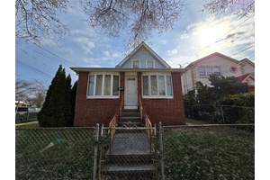 As you walk in the front door you are greeted with a large living room that was extended from an enclosed porch.