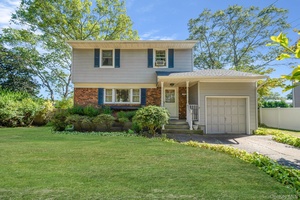 172 Norwood Ave presents a well cared for single family residence situated in the desirable Port Jefferson Station area.