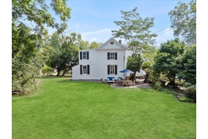 Don't be fooled by the Main Street address this property is privately situated on a corner lot, accessible from both streets.