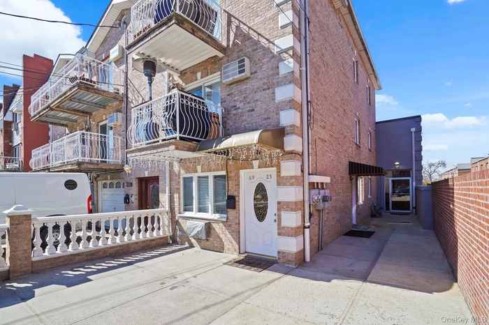 View of front of home featuring brick siding
