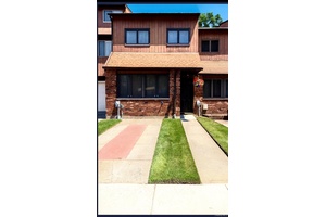 Step into this stunning townhome nestled in the highly sought after Stonegate Drive community.