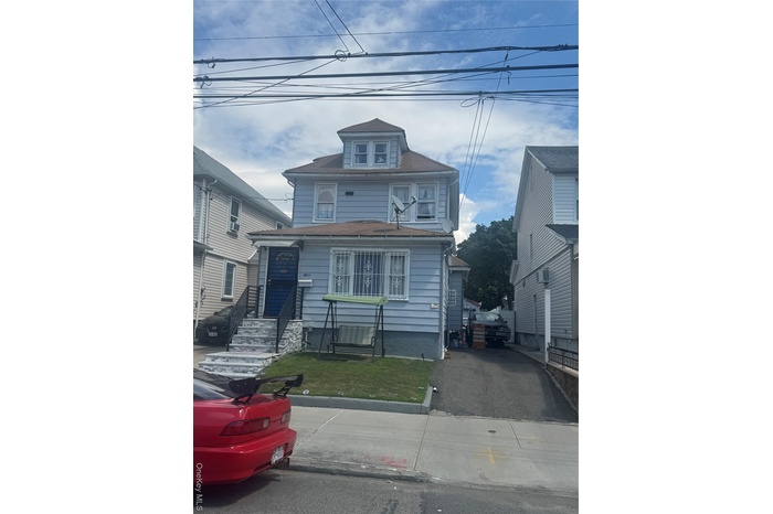 Traditional style home with a front yard
