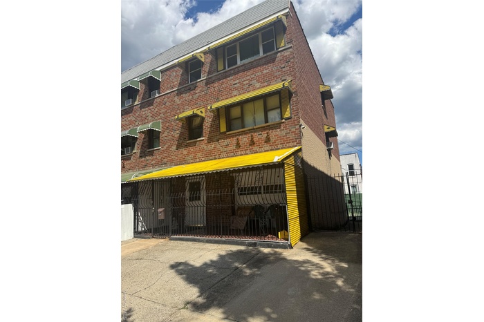 View of front of house with brick siding