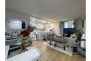Stunning, well maintained end unit, 3 bedroom, 2 bathrooms, updated open concept kitchen with quartz countertop and backsplash combined with quartz countertop dining with new pendant light.