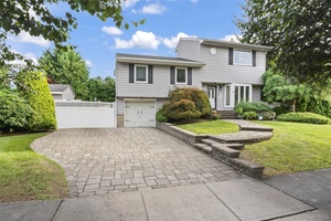 This fully updated 4 bedroom, 3 bath split level surrounded by 12 foot green giant trees combines modern luxury with privacy.