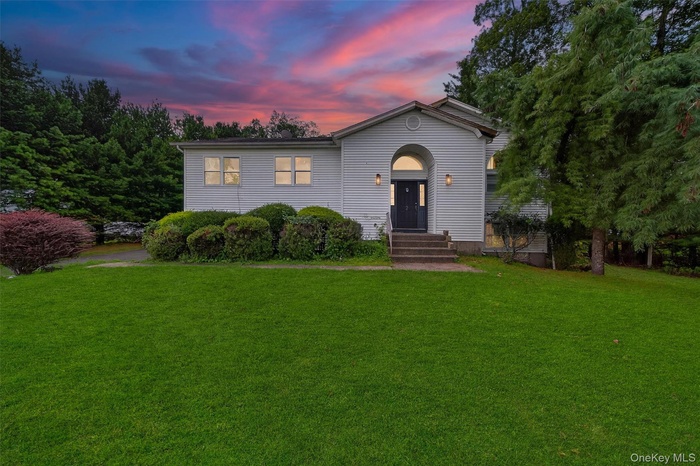 View of front of house featuring a yard