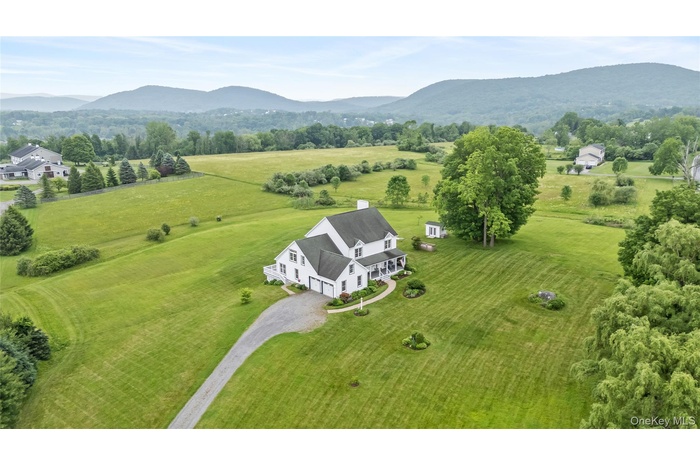 Gorgeous views of the mountains and sprawling acres from this aerial view