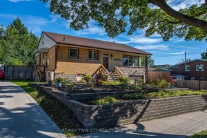 This sturdy brick bungalow practically waves hello with its fantastic curb appeal and sunny front porch that's perfect for morning coffee or evening relaxation.