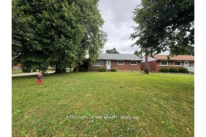 Welcome to this beautifully renovated 5 bedroom home, perfectly situated on a spacious lot with no backyard neighbors and backing directly onto a quiet schoolyard.