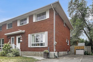 Absolutely delightful, all brick, rare FOUR Bedroom with upgrades galore, located in desirable Queensway Terrace North !