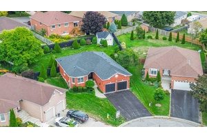 Absolutely stunning all brick, bungalow on a peaceful cul de sac, with a large, gorgeously landscaped pie shaped lot.