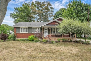 Solid, well maintained and updated bungalow on nice size lot with stunning curb appeal on a quiet street in the friendly town of Dunnvillle, includes bonus detached outbuilding.