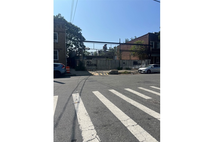 View of asphalt road with sidewalks