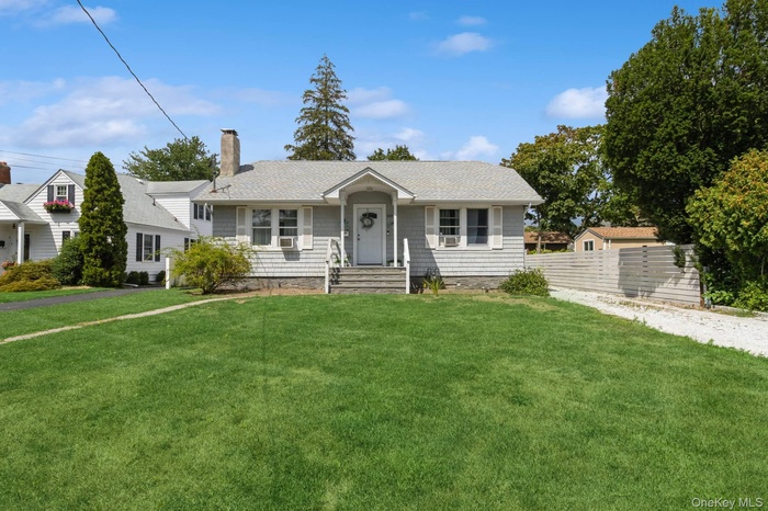 View of front of home featuring a chimney