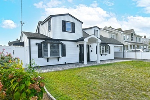 Completely renovated two story home with sleek, modern style and incredible curb appeal.