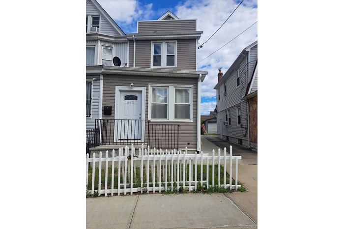 View of front of home with a fenced front yard