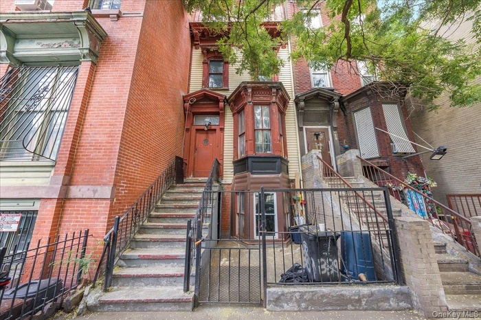 View of property featuring stairs