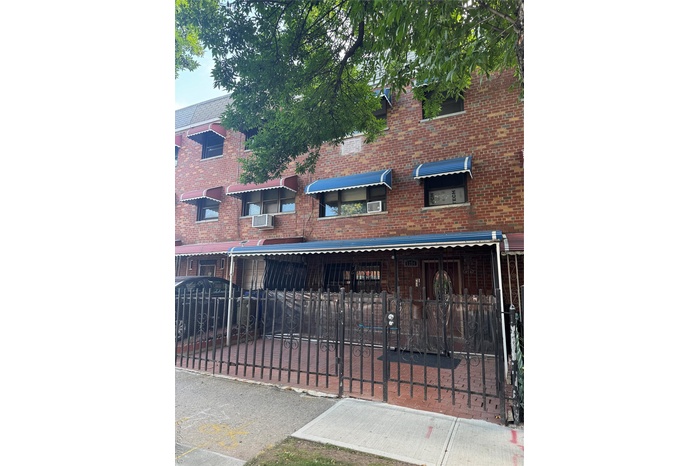 View of front of property with brick siding