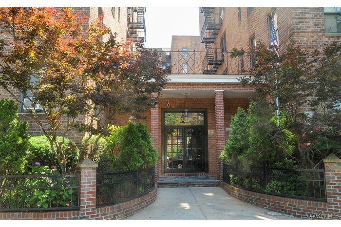 Property entrance with brick siding and french doors