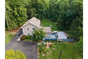 Welcome to 6 Autumn Lane, a charming Monroe retreat set on 2.