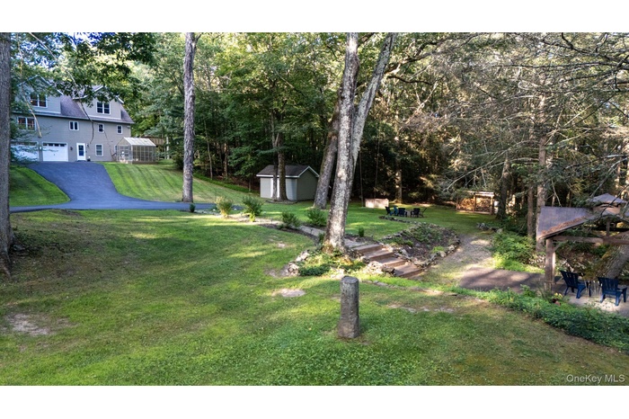 View of green lawn with a shed