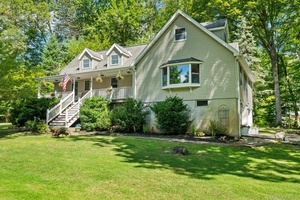 Live your dream in this beautifully updated 4 bedroom, 2 and 1 2 bathroom Cape Cod with welcoming covered front porch, a separate home office and finished lower level in ...