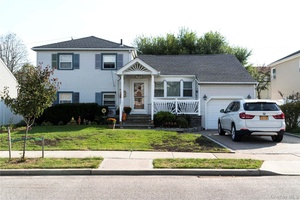 mid block, pristinely maintained split house renovated kitchen with wolf range.