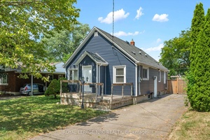 Adorable three bedroom bungalow with full basement located in Secord Woods.