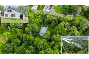 RIVERFRONT RETREAT ON A SECLUDED LOT.